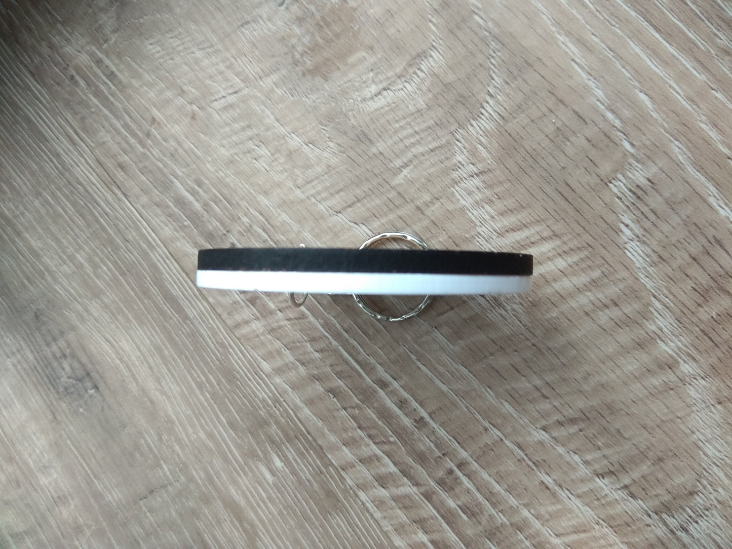 Round wooden keyring with colourful acrylic backing and a laser-cut Flamingo design – personalised with engraved child’s name, perfect for school bags.