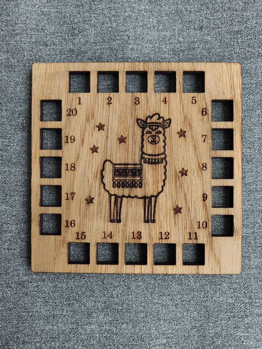 Square shape thread holder, with Llama and stars engraved in the middle. 20 holes for thread.