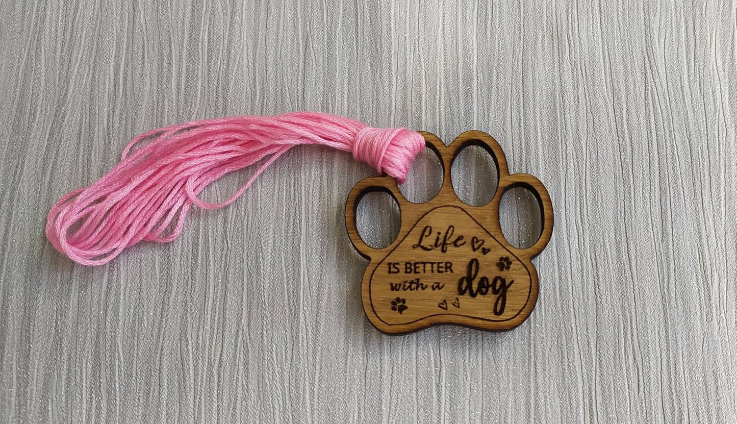 Mini thread holder and needle minder, engraved with the message 'Life is better with a dog'. A practical and heartwarming accessory for any sewing or crafting enthusiast, this dual-purpose item keeps your threads organised and your needles safe.