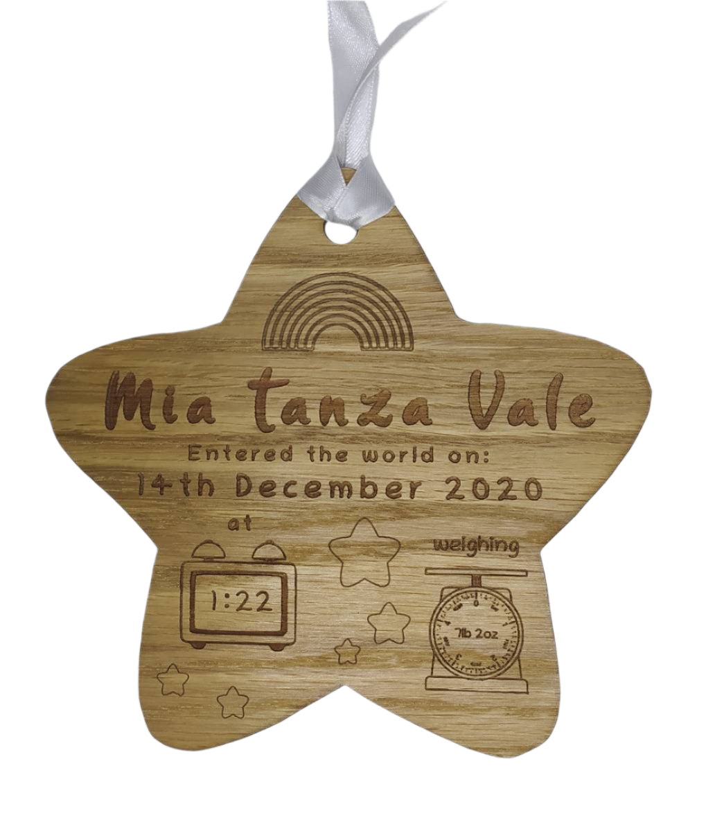 Personalised oak veneer wooden star engraved with a newborn's full name, date of birth, time, and weight. Finished with a white string for hanging, making it a thoughtful keepsake for families.