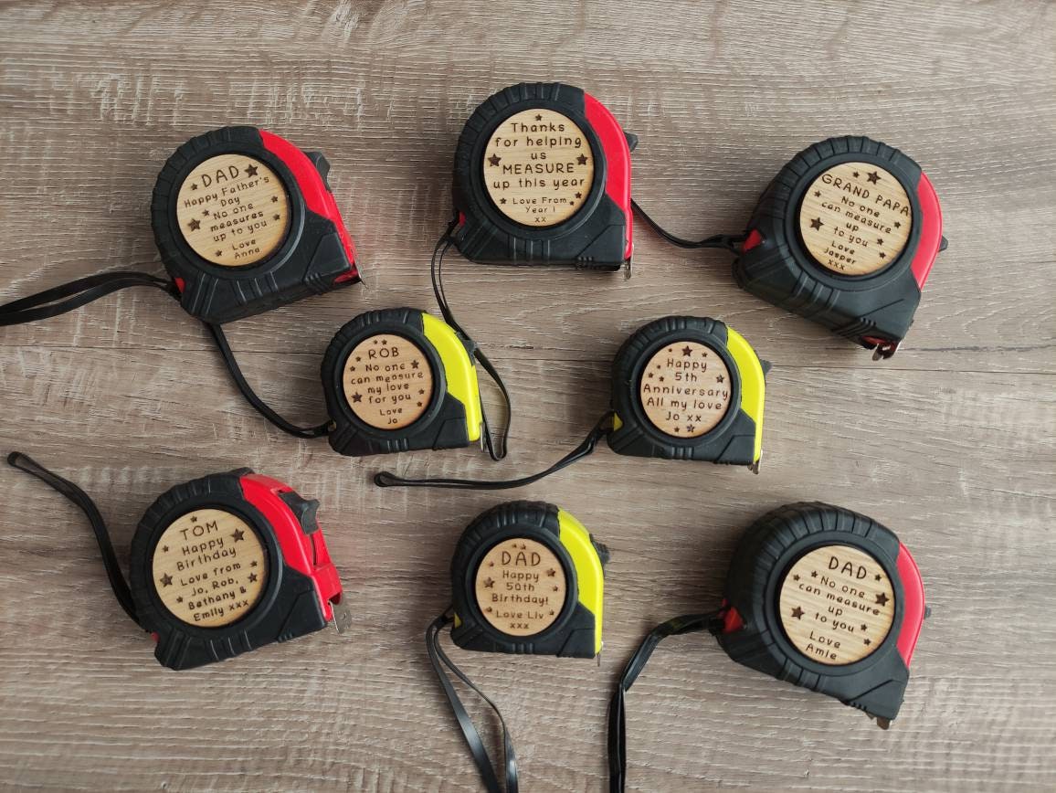 Personalised tape measure with a wooden disc, custom engraved names with your chosen message. This unique, functional gift combines practicality with a fun, stylish touch.