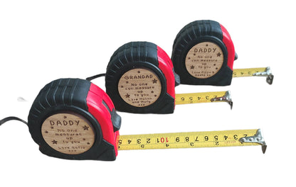 Personalised tape measure with a wooden disc, custom engraved names with your chosen message. This unique, functional gift combines practicality with a fun, stylish touch.