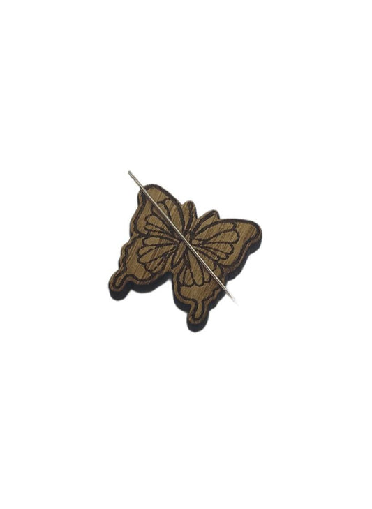Butterfly shape needle minder on oak veneer wood