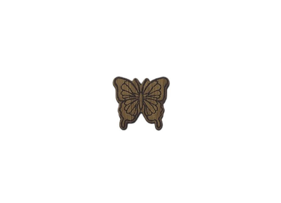 Butterfly shape needle minder on oak veneer wood