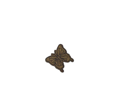 Butterfly shape needle minder on oak veneer wood