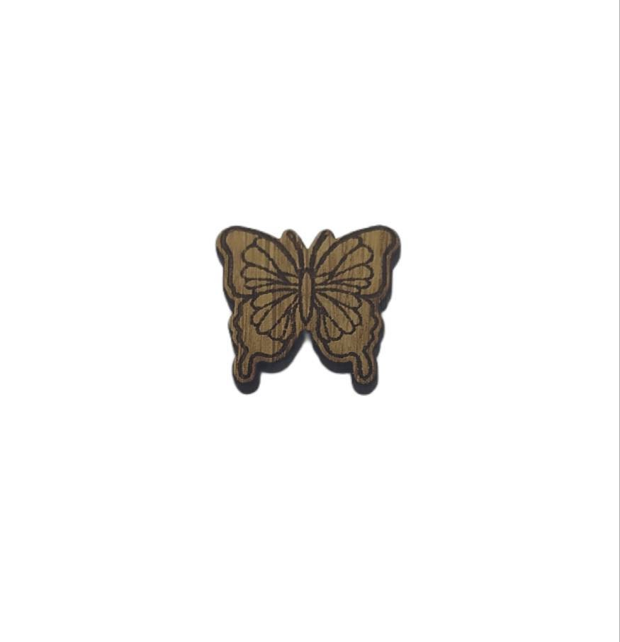 Butterfly shape needle minder on oak veneer wood