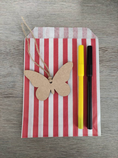 Wooden laser-cut shape with a hole at the top for hanging, string included, and 2 coloured pens inside a paper bag.