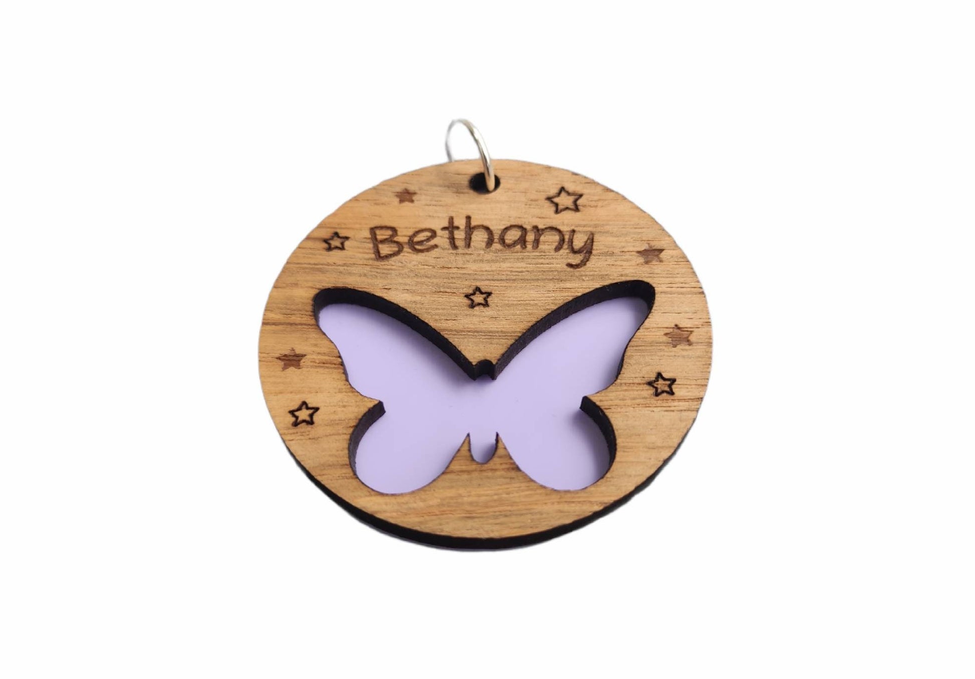 Circular keyring featuring a cut-out butterfly design backed with colourful acrylic, laser engraved with a personalised name on oak veneer.