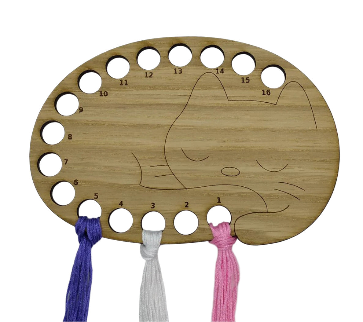Cat thread holder in a sleeping cat design with 16 holes for thread.