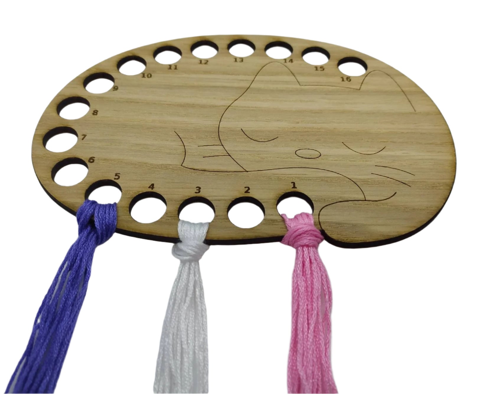 Cat thread holder in a sleeping cat design with 16 holes for thread.