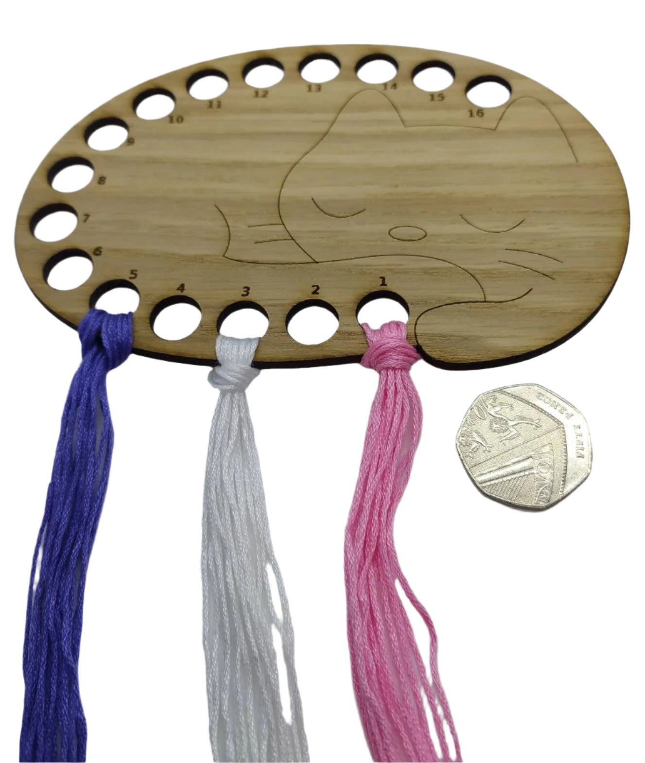 Cat thread holder in a sleeping cat design with 16 holes for thread.