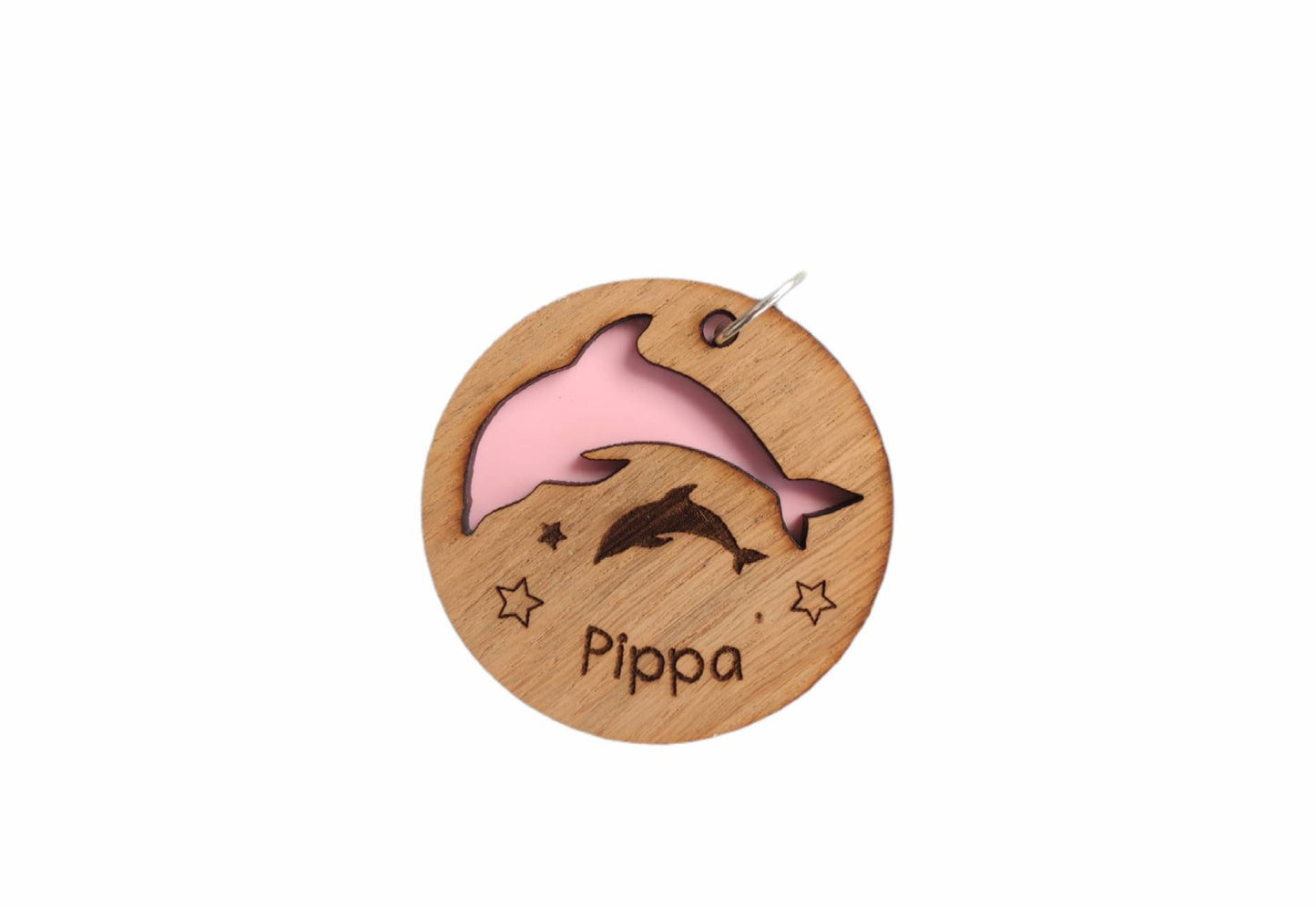 Circle keyring with a cut-out dolphin shape, backed with coloured acrylic, engraved with any name.