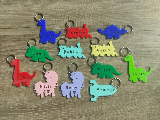 Coloured acrylic keyrings with a name cut out in various fun designs.