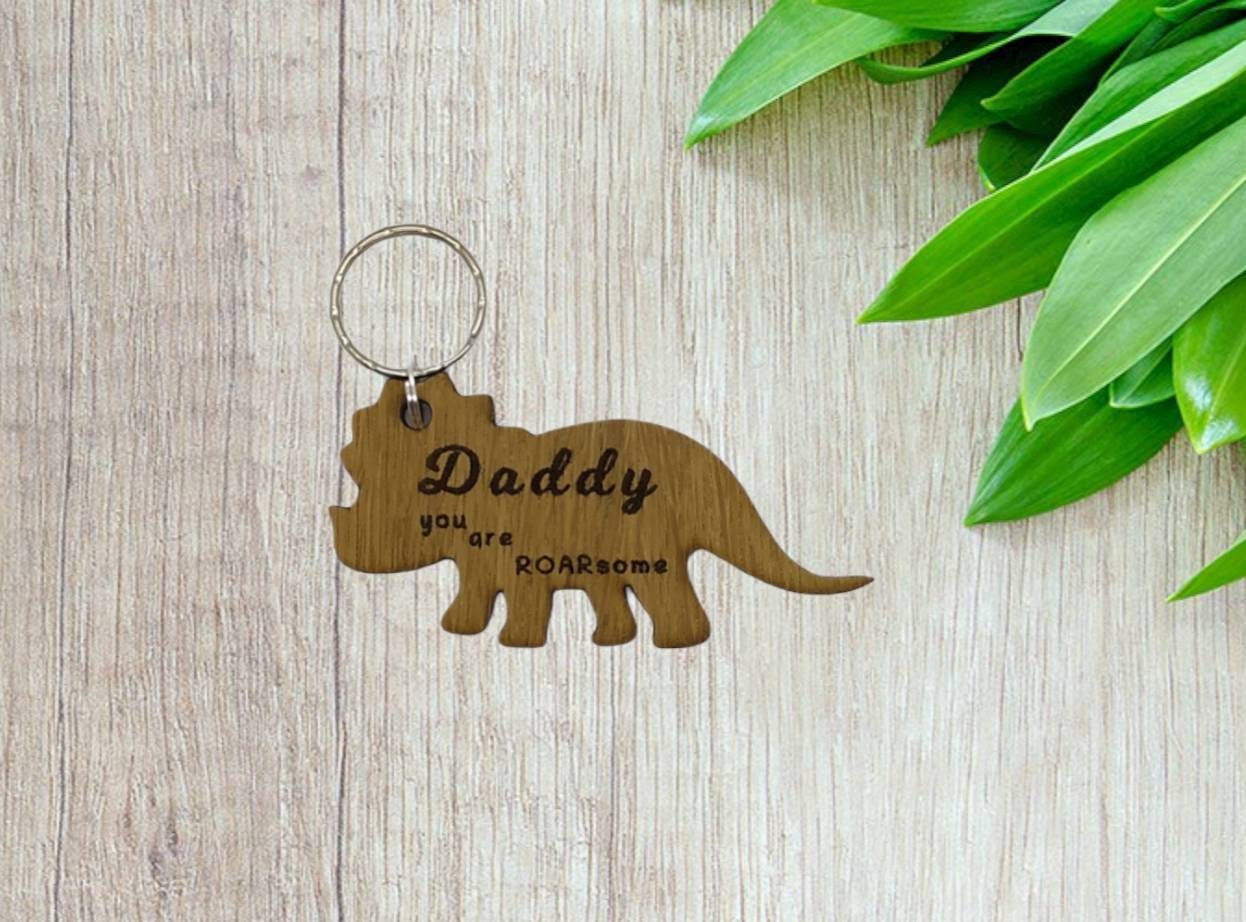 Triceratops keyring, engraved with "Daddy you are ROARsome," perfect for Father's Day or a special gift