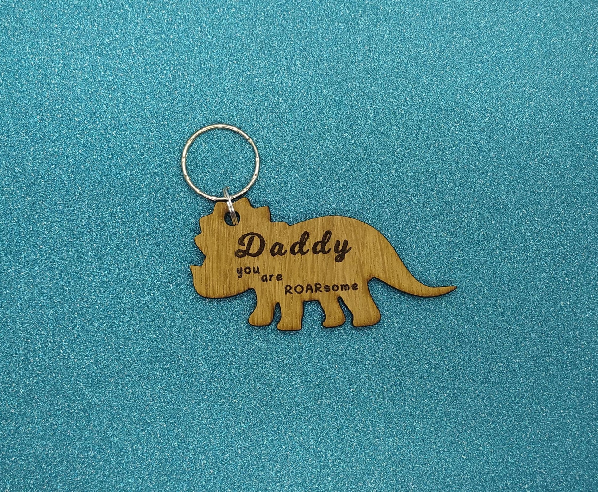 Triceratops keyring, engraved with "Daddy you are ROARsome," perfect for Father's Day or a special gift