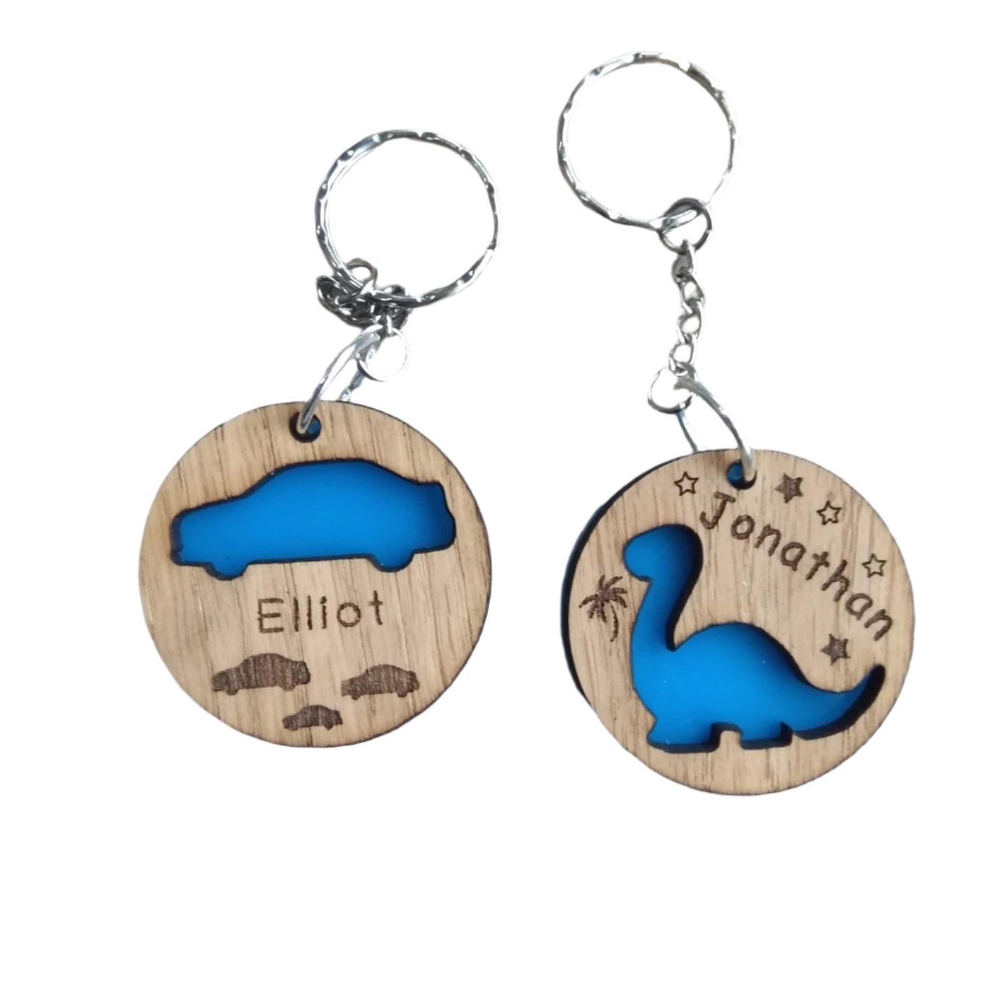 Round keyring with a Diplodocus shape cut out and backed with coloured acrylic, engraved with any name.