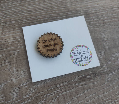 Round soft jagged edges needle minder with "Do What Makes You Happy" engraved: