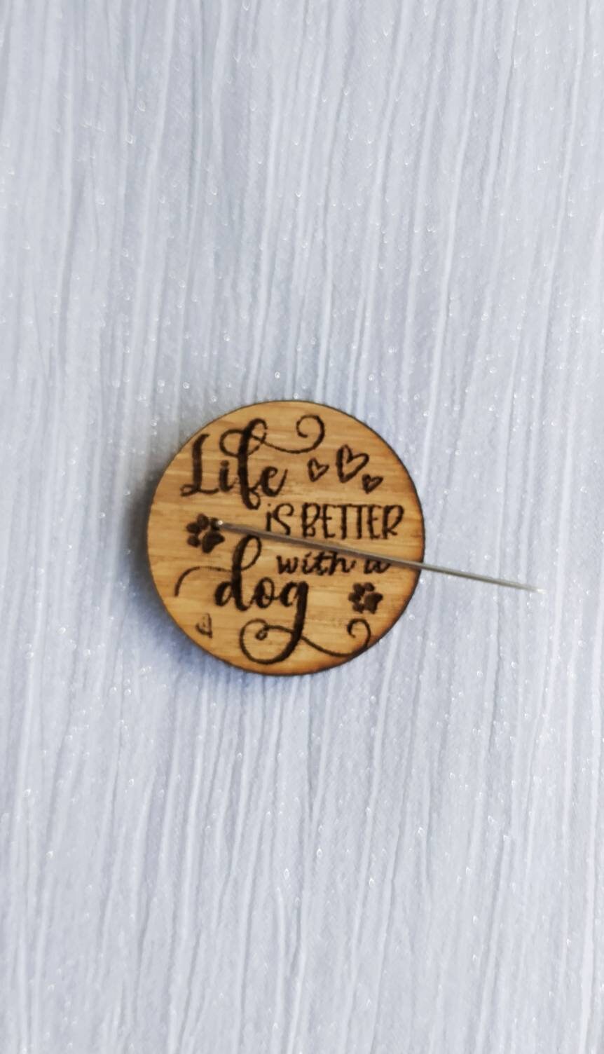 Round needle minder engraved with 'Life is Better with a Dog'