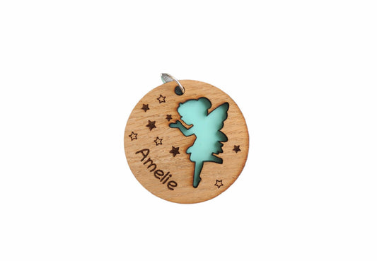 Circle wooden keyring with a fairy cut-out, engraved with any name.