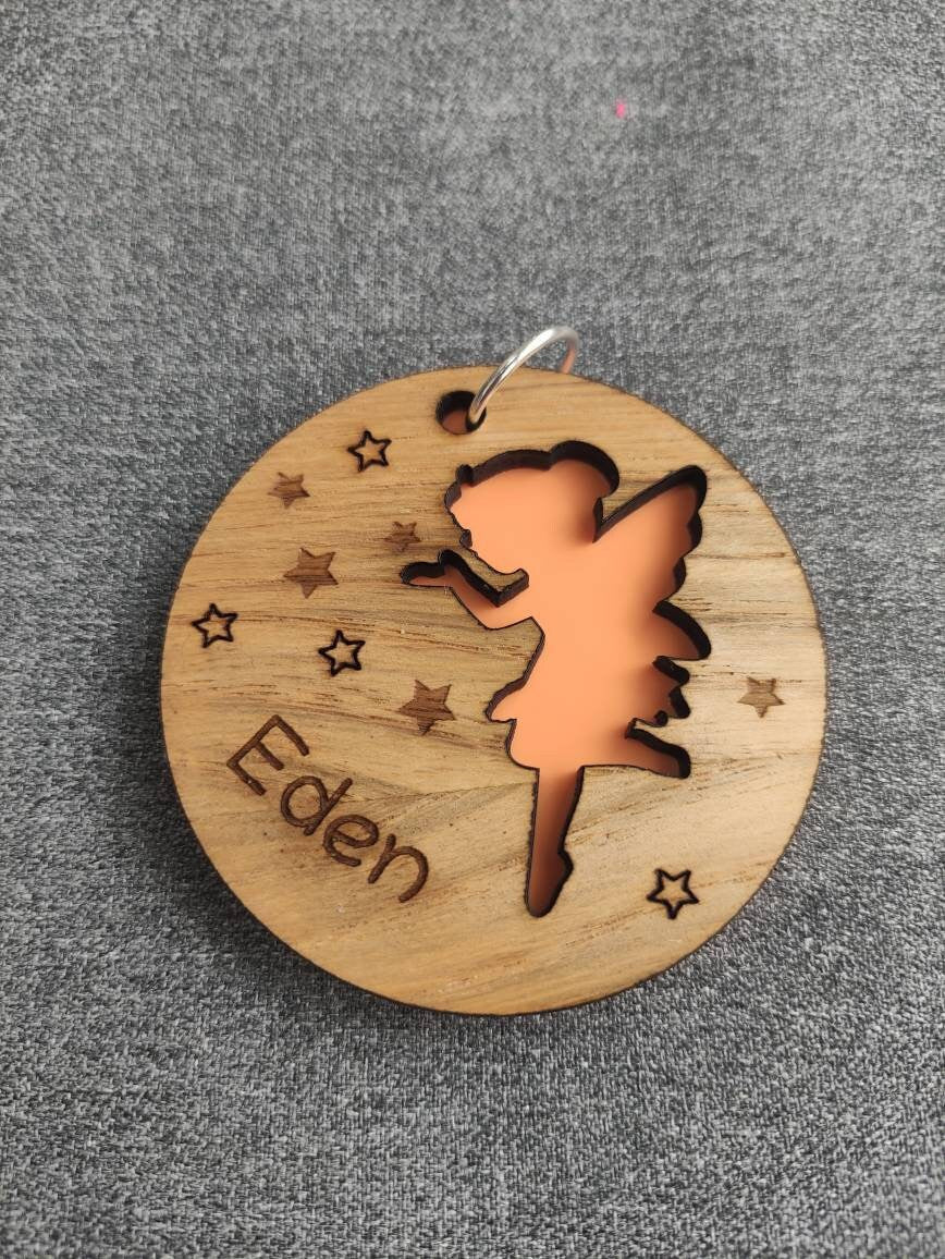 Circle wooden keyring with a fairy cut-out, engraved with any name.