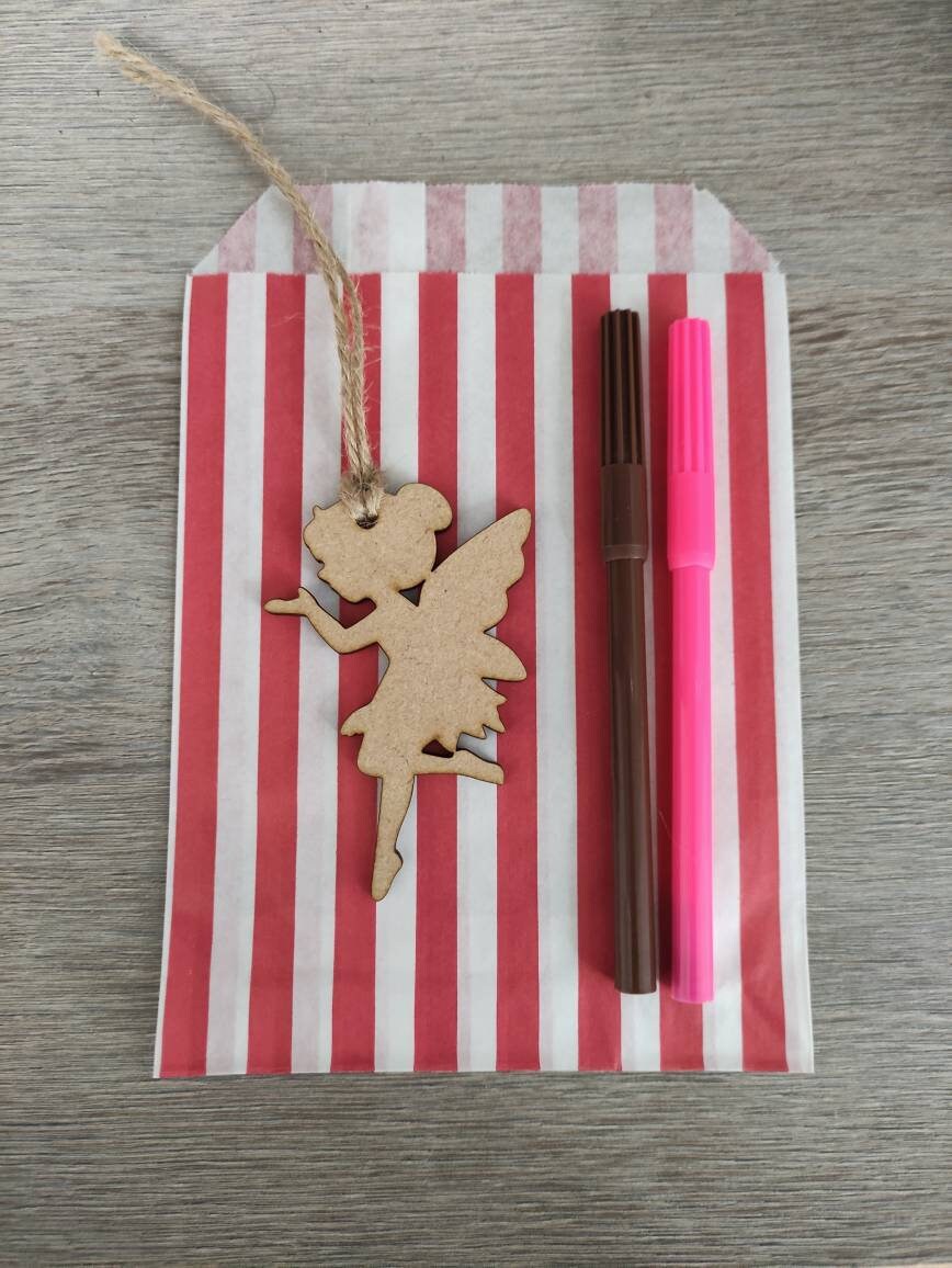 Wooden laser-cut shape with a hole at the top for hanging, string included, and 2 coloured pens inside a paper bag.