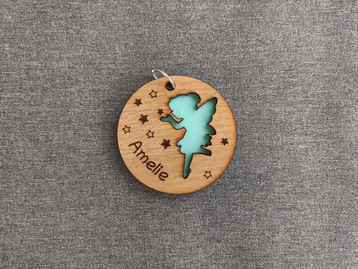 Circle wooden keyring with a fairy cut-out, engraved with any name.
