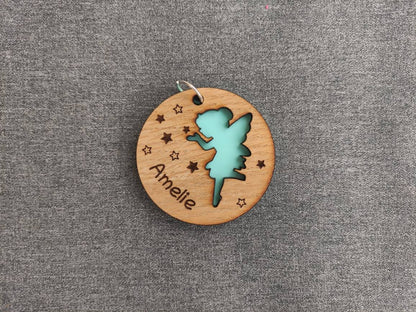 Circle wooden keyring with a fairy cut-out, engraved with any name.
