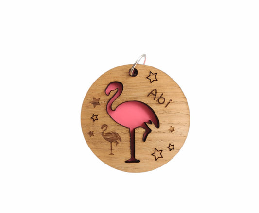 Round wooden keyring with colourful acrylic backing and a laser-cut Flamingo design – personalised with engraved child’s name, perfect for school bags.