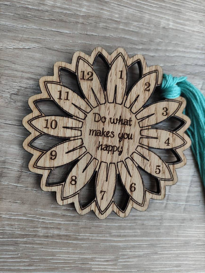 Flower thread holder with "Do What Makes You Happy" engraved, featuring holes for 12 threads.