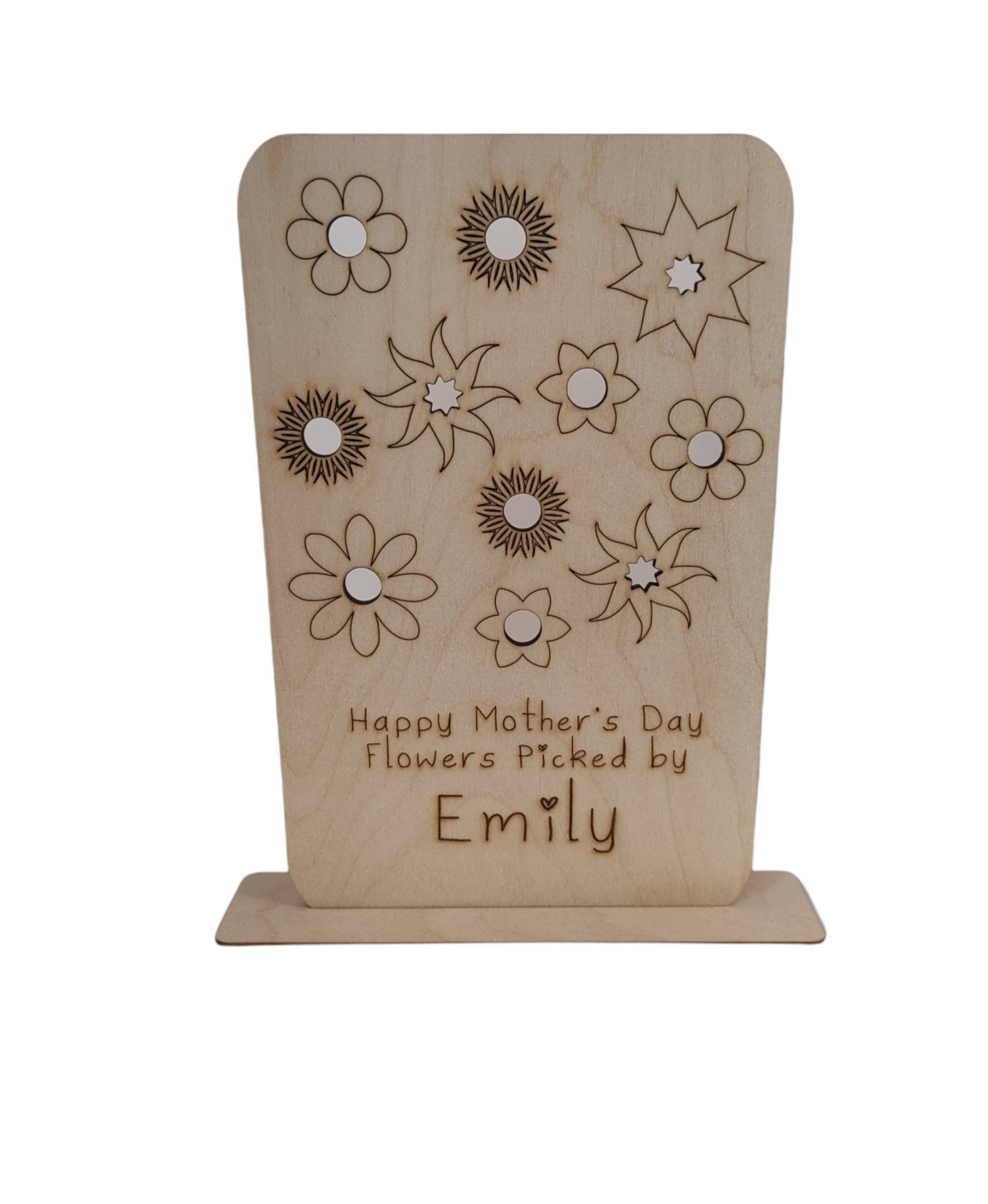 Personalised wooden floral decoration, intricately laser-engraved with flower designs and featuring holes to add your own blooms. 
