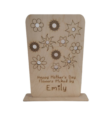 Personalised wooden floral decoration, intricately laser-engraved with flower designs and featuring holes to add your own blooms. 