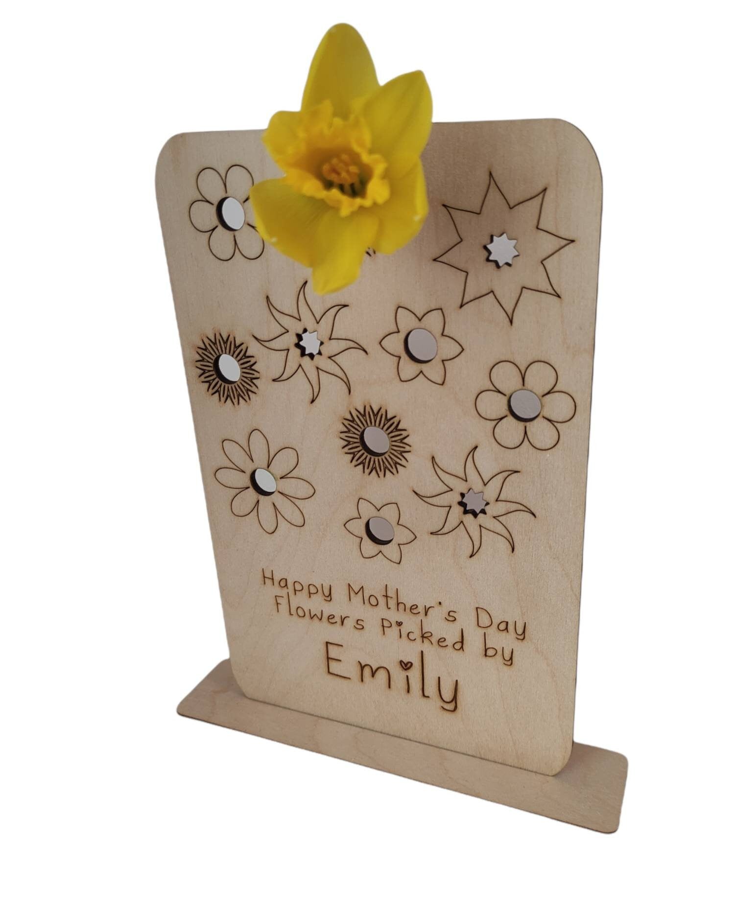 Personalised wooden floral decoration, intricately laser-engraved with flower designs and featuring holes to add your own blooms. 