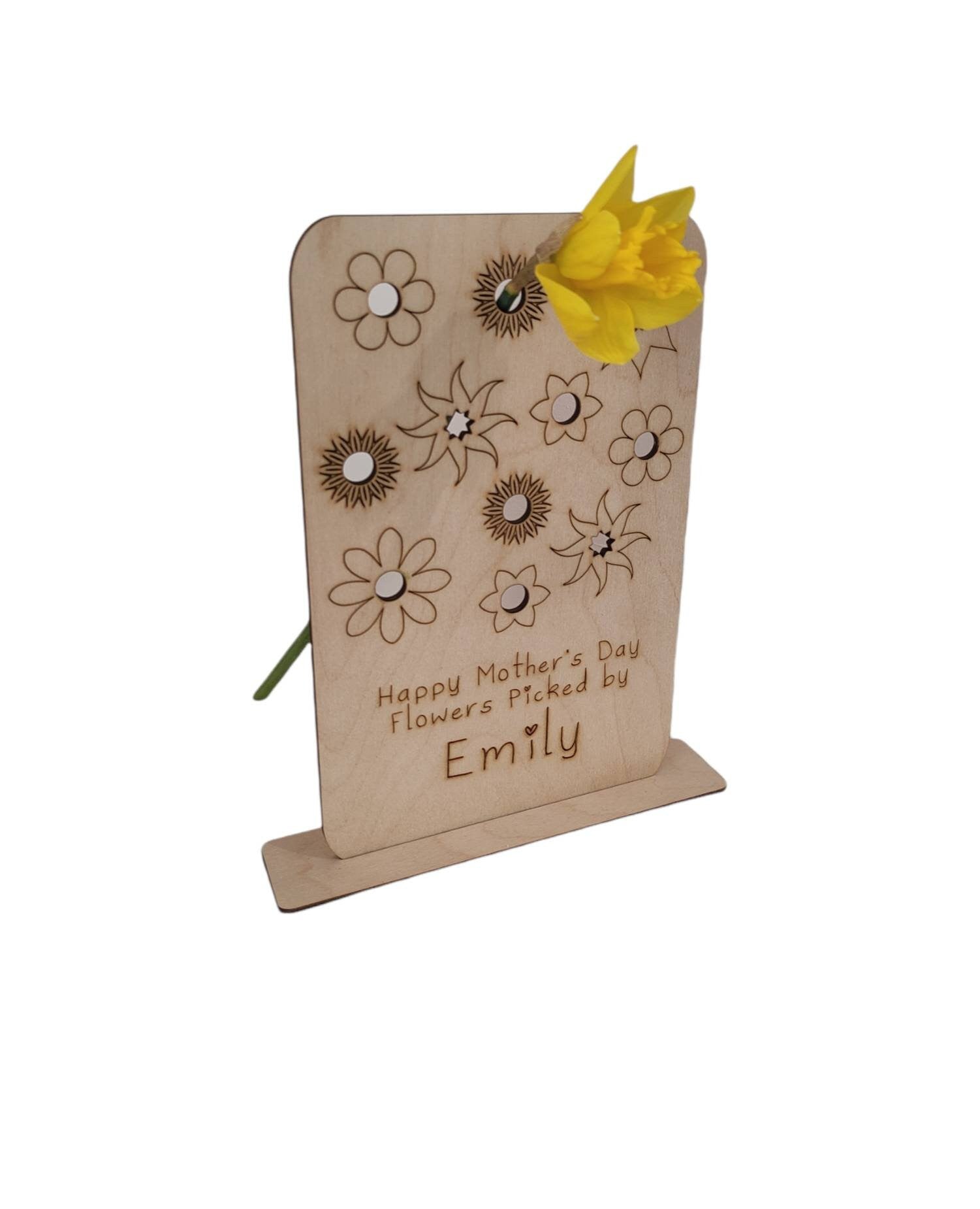 Personalised wooden floral decoration, intricately laser-engraved with flower designs and featuring holes to add your own blooms. 