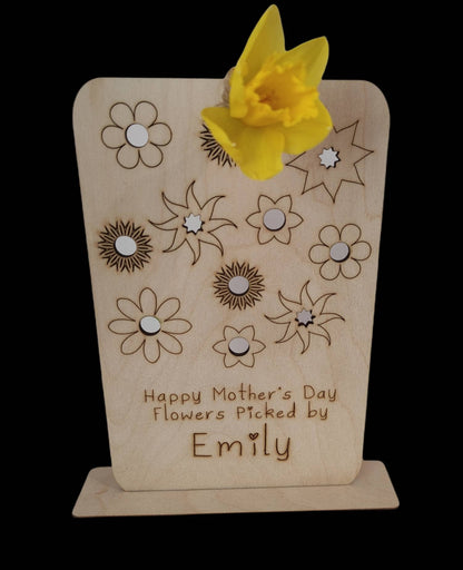 Personalised wooden floral decoration, intricately laser-engraved with flower designs and featuring holes to add your own blooms. 