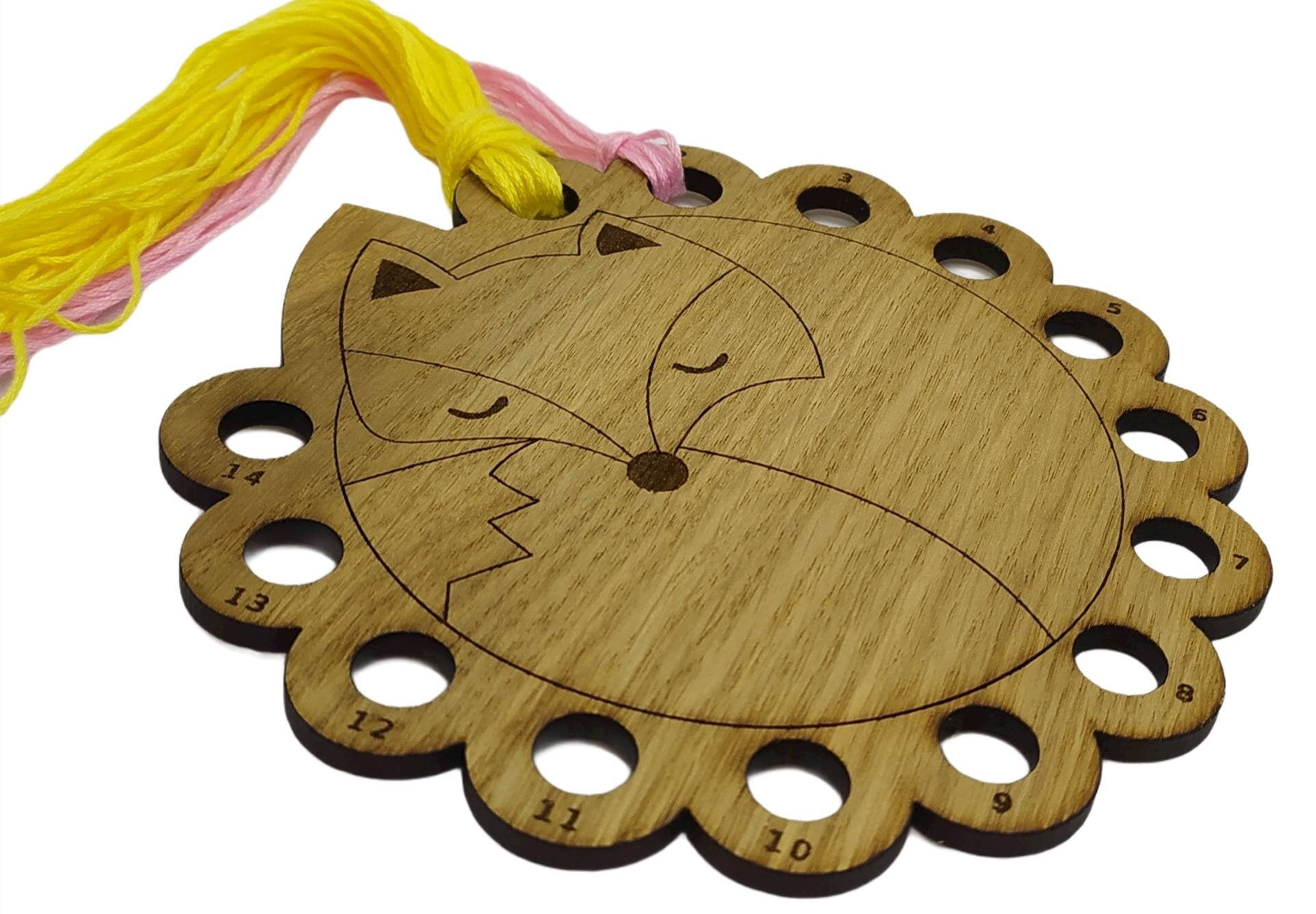 Curled up fox thread holder with 14 holes for thread