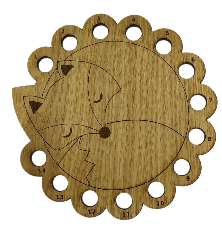 Curled up fox thread holder with 14 holes for thread