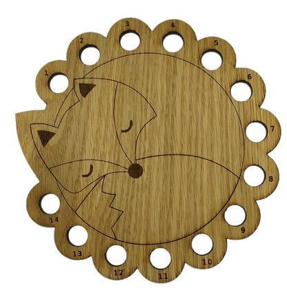 Curled up fox thread holder with 14 holes for thread