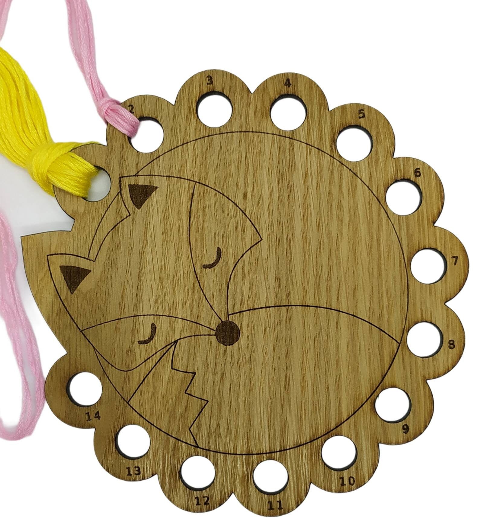 Curled up fox thread holder with 14 holes for thread