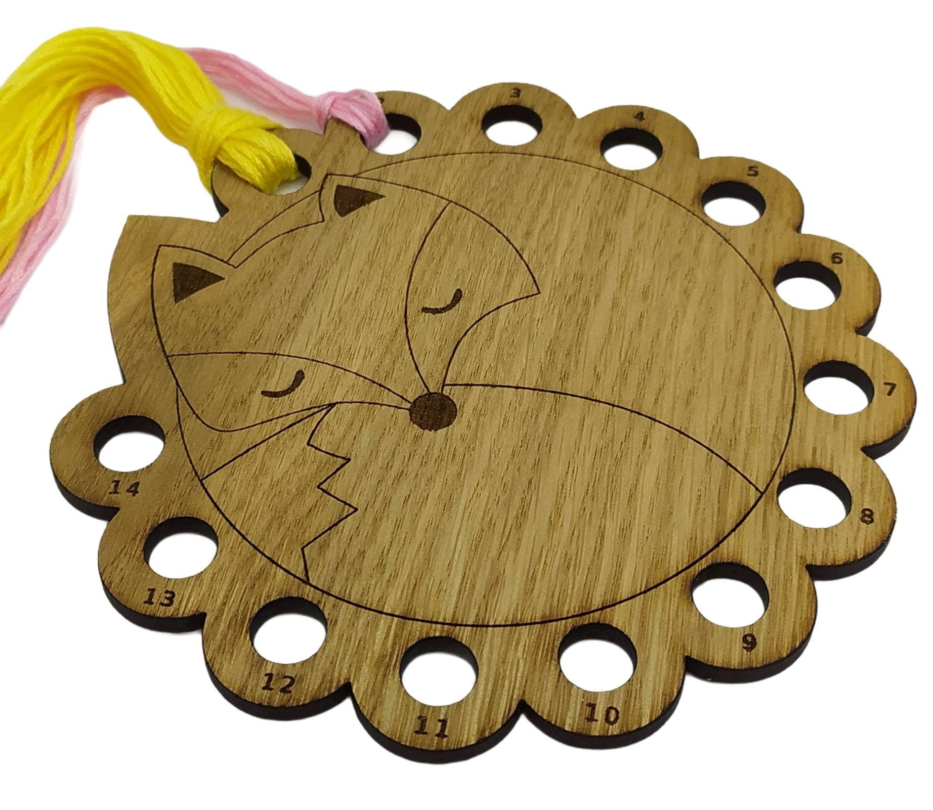 Curled up fox thread holder with 14 holes for thread