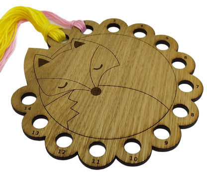 Curled up fox thread holder with 14 holes for thread