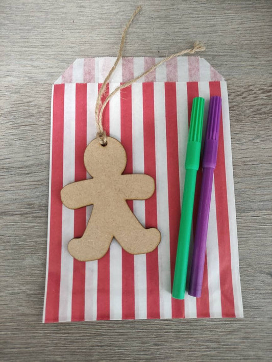  Wooden laser-cut shape with a hole at the top for hanging, string included, and 2 coloured pens inside a paper bag.