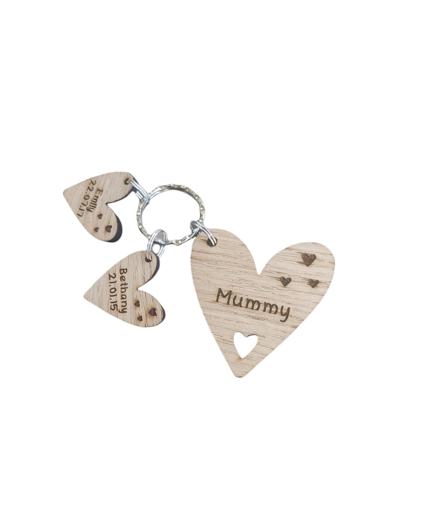  Personalised heart-shaped wooden keyring engraved with "Mummy" and customisable with charms featuring a child’s name and date of birth.