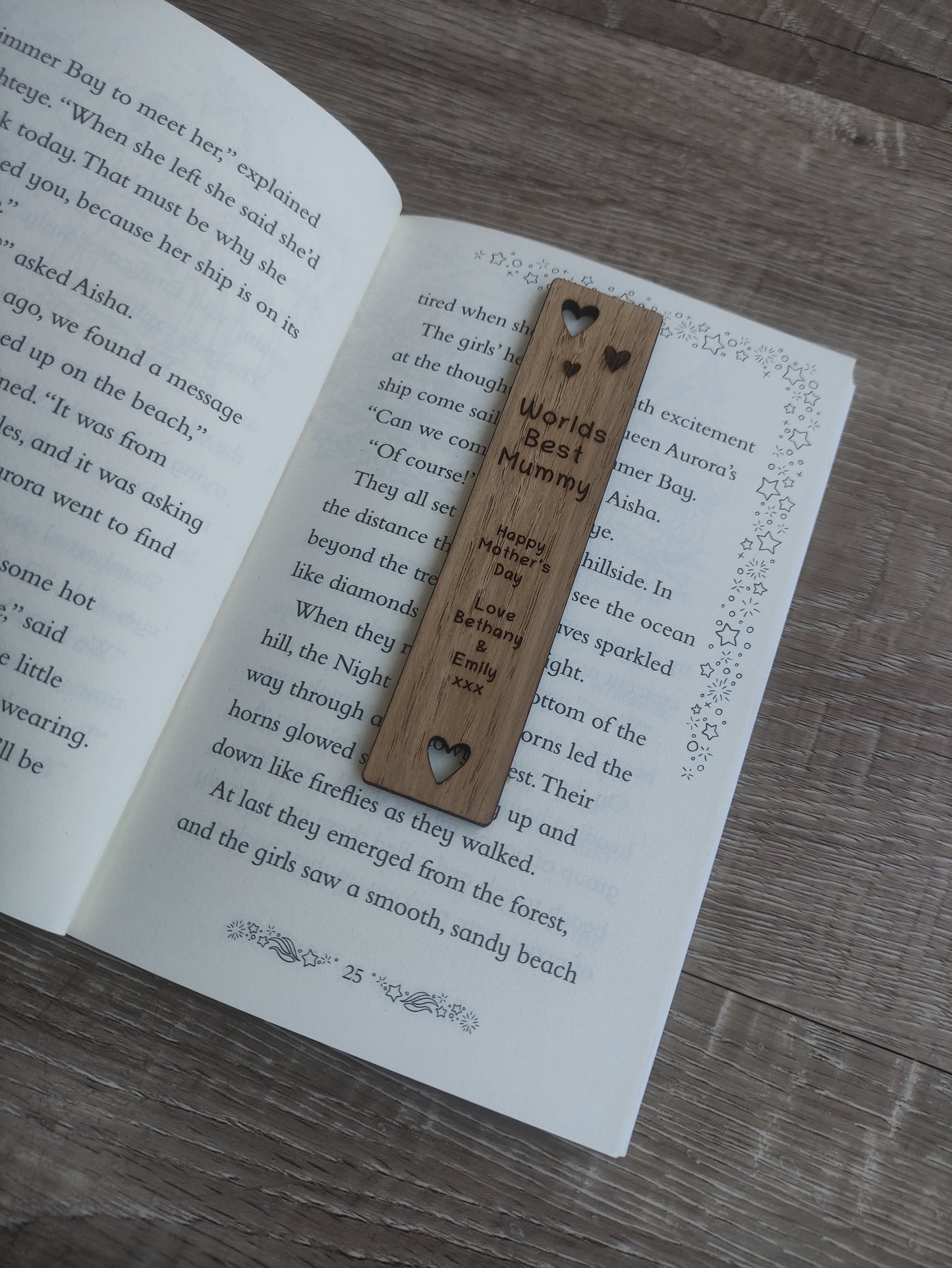 Wooden bookmark featuring cut-out heart shapes and custom engraving, personalised with any wording.