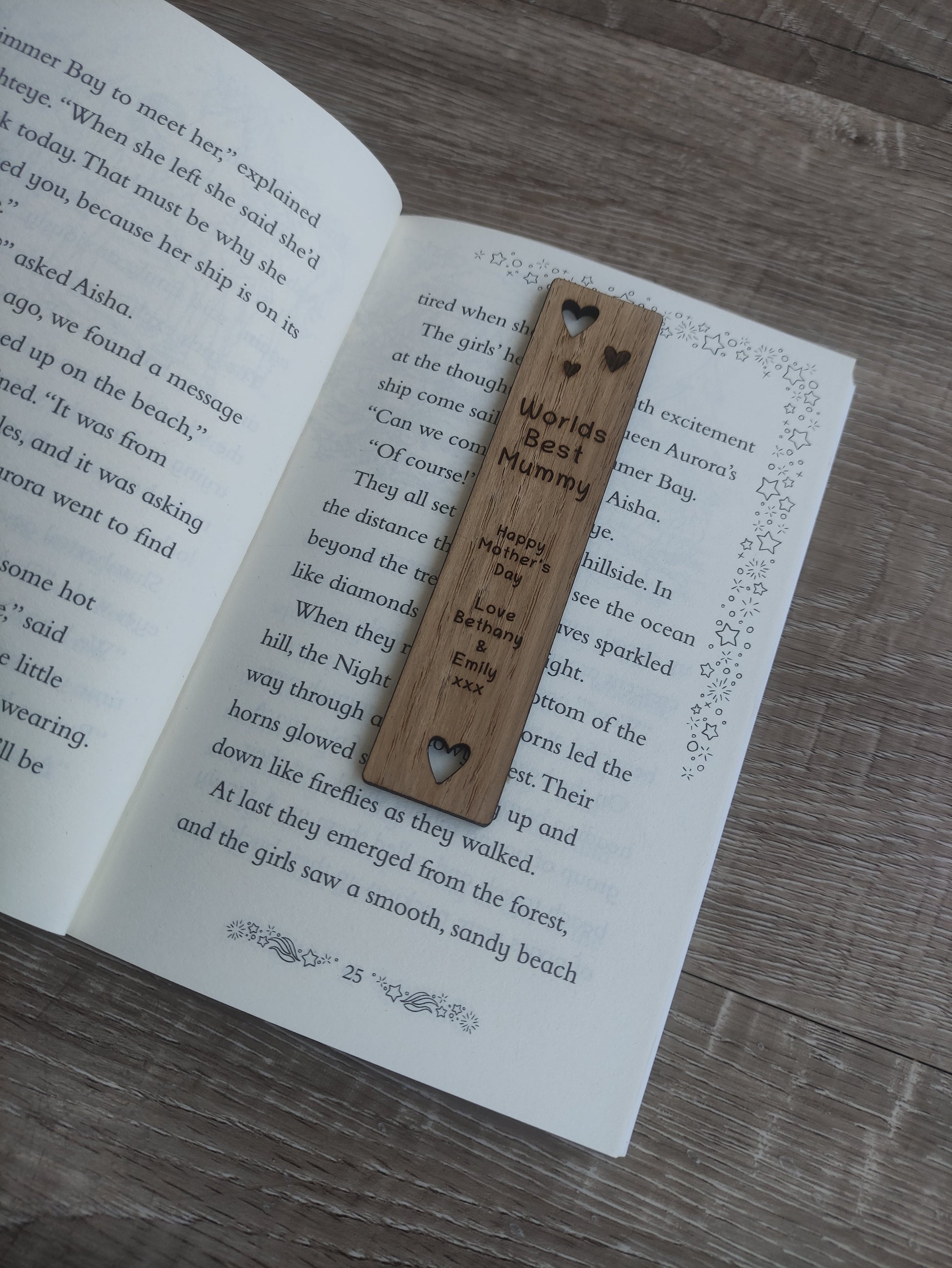 Wooden bookmark featuring cut-out heart shapes and custom engraving, personalised with any wording.