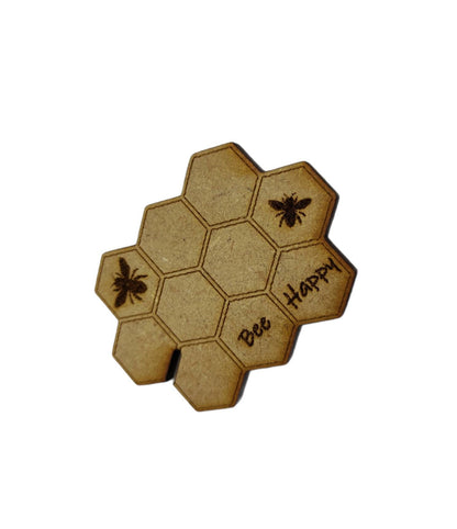 Honeycomb-shaped bobbin for keeping your thread tidy, engraved with bees and 'Bee Happy' design.