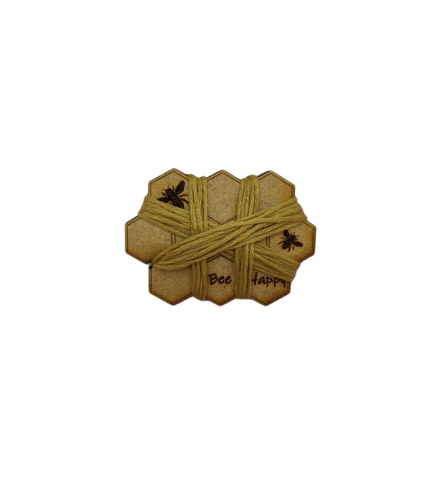 Honeycomb-shaped bobbin for keeping your thread tidy, engraved with bees and 'Bee Happy' design.