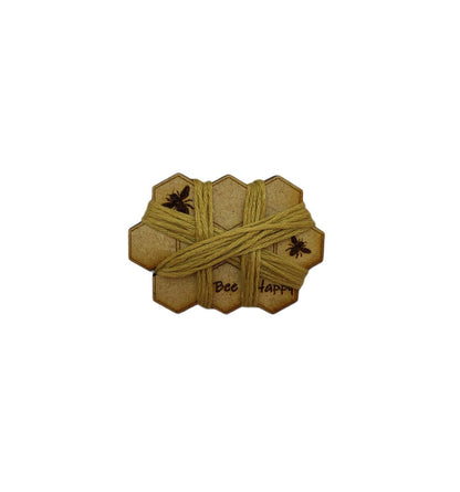 Honeycomb-shaped bobbin for keeping your thread tidy, engraved with bees and 'Bee Happy' design.