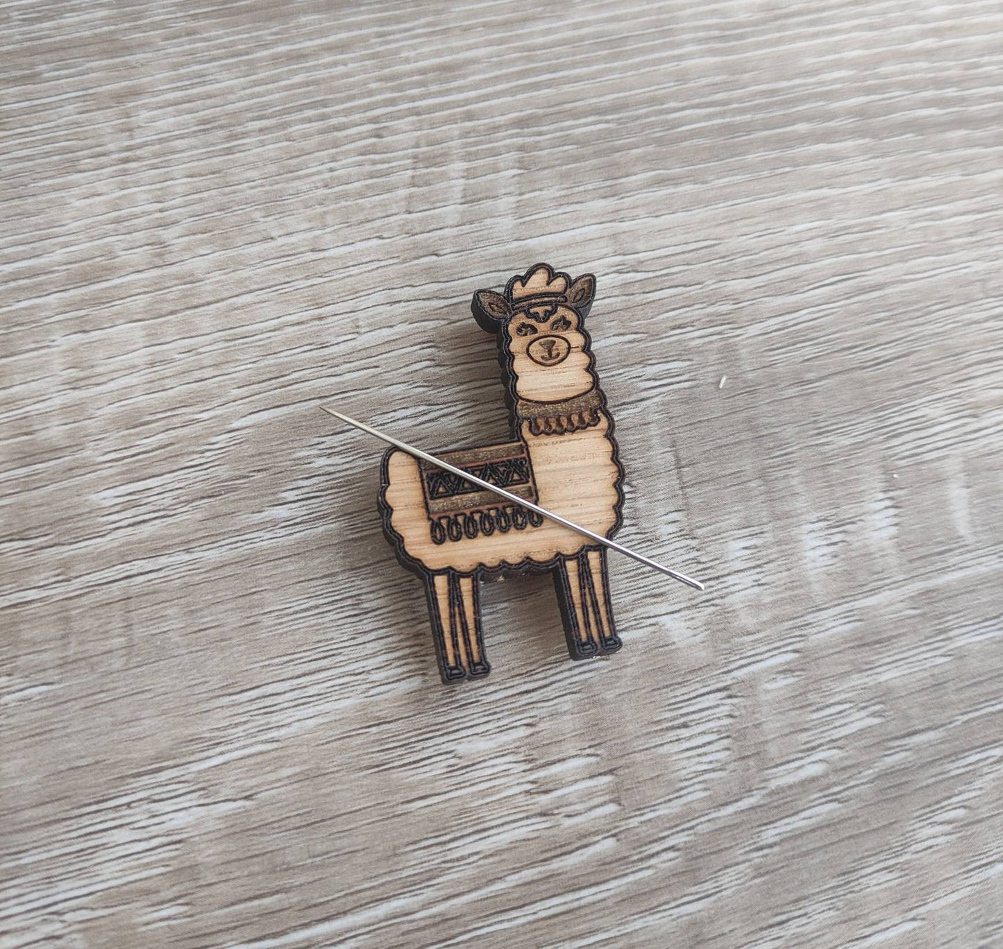 Llama needle minder with a strong magnet, designed to keep your needles organised and prevent them from getting lost.