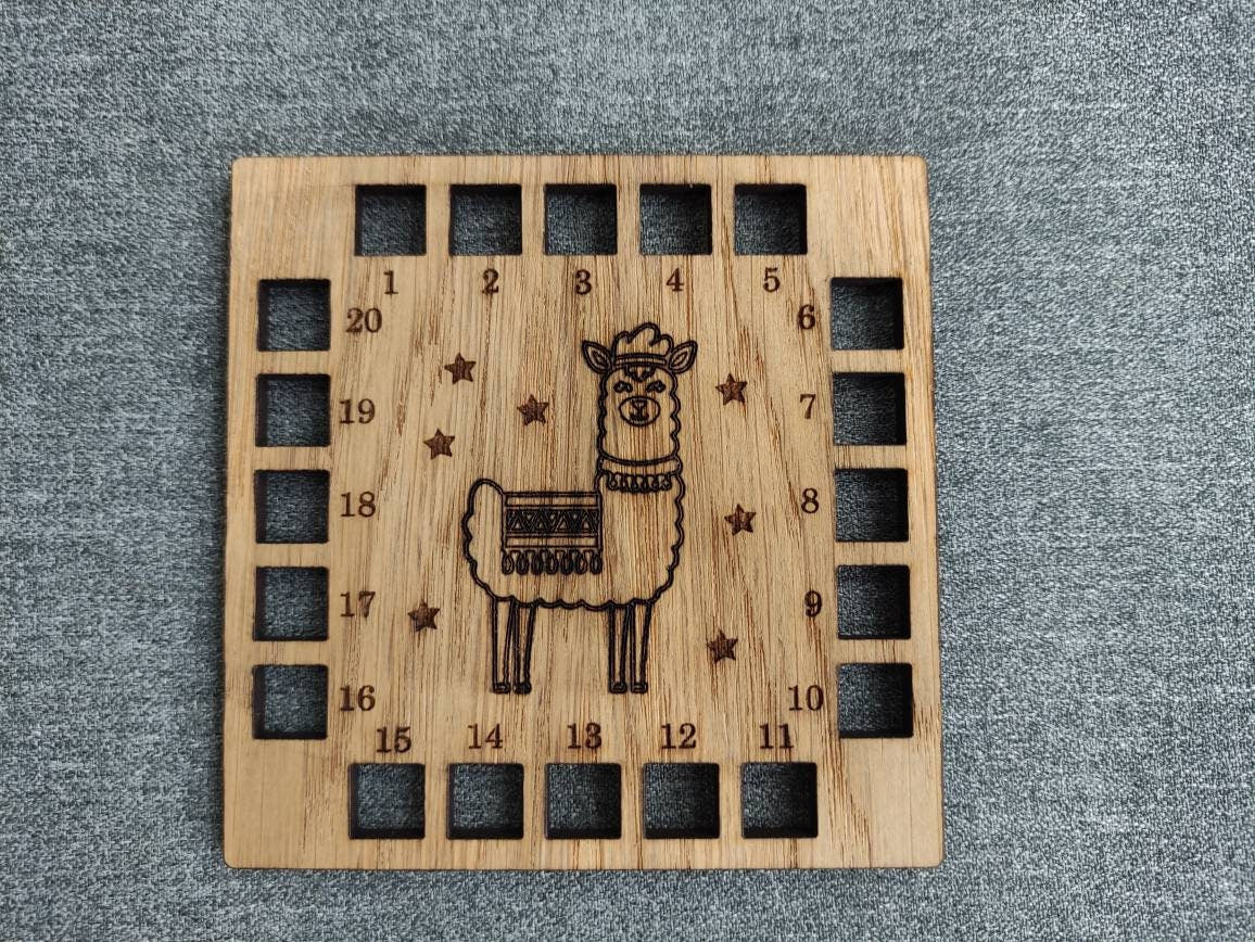 Square shape thread holder, with Llama and stars engraved in the middle. 20 holes for thread.