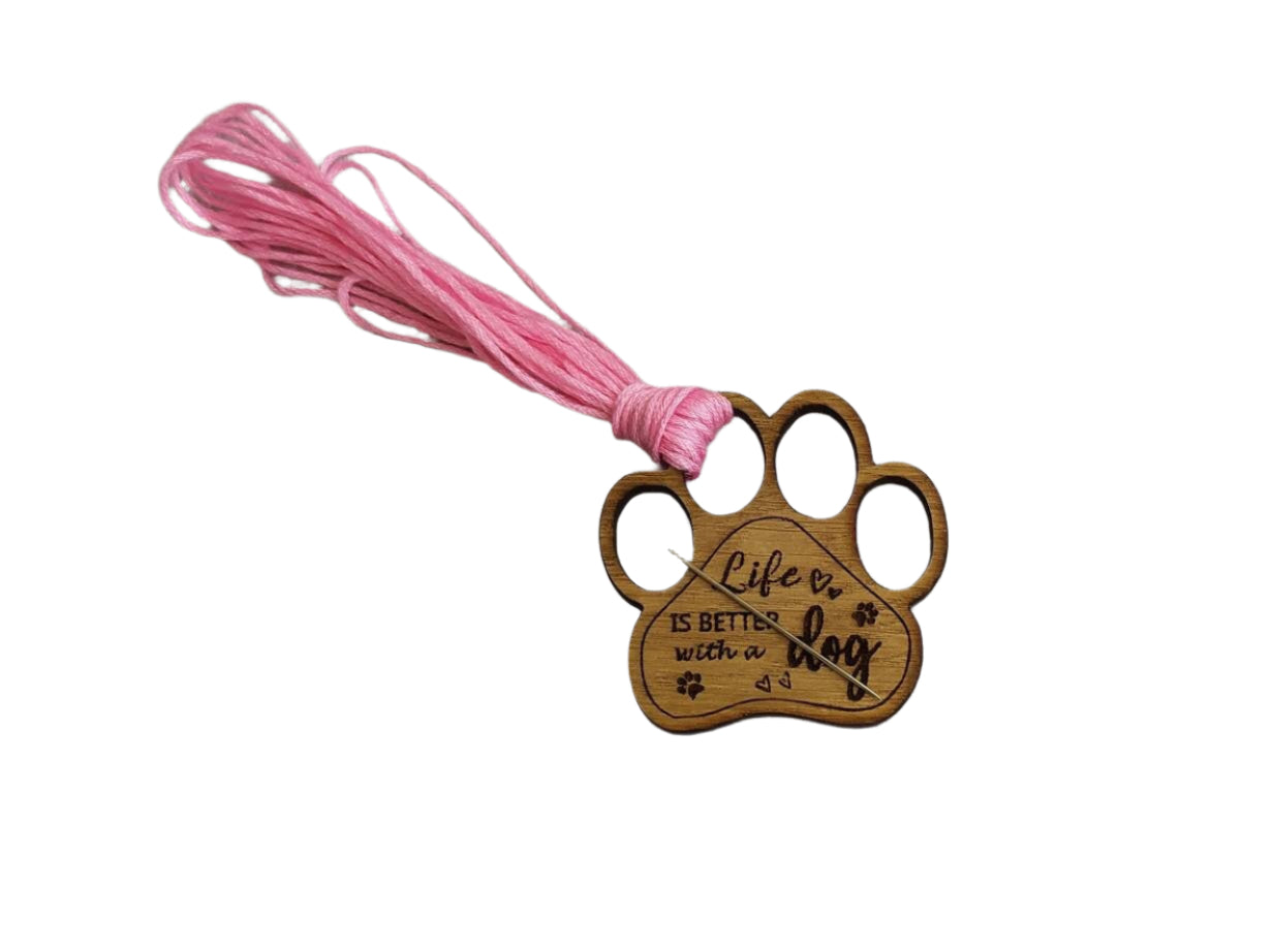 Mini thread holder and needle minder, engraved with the message 'Life is better with a dog'. A practical and heartwarming accessory for any sewing or crafting enthusiast, this dual-purpose item keeps your threads organised and your needles safe.